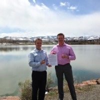 Contract Signing in Colorado with Mountains in the Background